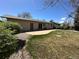 A spacious backyard with a concrete patio and lush green lawn perfect for outdoor entertaining at 12831 E Mexico Ave, Aurora, CO 80012