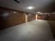 Unfinished basement with wood paneling and carpet floors offers great storage space at 12831 E Mexico Ave, Aurora, CO 80012