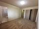 A comfy bedroom features neutral walls, carpet, closet and access to an ensuite bathroom at 12831 E Mexico Ave, Aurora, CO 80012