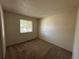 Bedroom featuring a window, neutral walls, and carpeting at 12831 E Mexico Ave, Aurora, CO 80012
