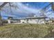 Backyard with a spacious grassy area and patio at 8610 Jolene Dr, Denver, CO 80229