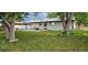 Large backyard features a well-manicured lawn at 8610 Jolene Dr, Denver, CO 80229
