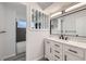 Stylish bathroom featuring a new vanity, marble countertop, and modern fixtures at 8610 Jolene Dr, Denver, CO 80229