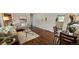 Cozy living room with hardwood floors, a view to dining, and stylish decor at 8610 Jolene Dr, Denver, CO 80229