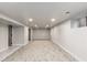 Spacious finished basement with carpeted floors, recessed lighting, and a window providing natural light at 3250 N Clayton St, Denver, CO 80205