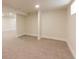 Spacious basement area featuring neutral walls and carpeted flooring at 3250 N Clayton St, Denver, CO 80205