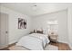 Bright bedroom with a cozy bed, stylish side tables, and a window with natural light at 3250 N Clayton St, Denver, CO 80205