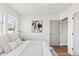 This bedroom offers a blend of natural light, neutral tones, and modern decor for a peaceful retreat at 3250 N Clayton St, Denver, CO 80205