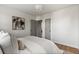 Bedroom showcasing multiple doors, neutral walls, and comfortable bedding, offering a modern and inviting appeal at 3250 N Clayton St, Denver, CO 80205