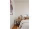Inviting bedroom with soft lighting, a cozy bed, and elegant nightstand for a relaxing and comfortable ambiance at 3250 N Clayton St, Denver, CO 80205