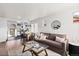Inviting living room with hardwood floors, contemporary decor, and seamless flow to the adjacent kitchen at 3250 N Clayton St, Denver, CO 80205