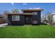 Stylish exterior view of home with neat lawn, dark siding, and clean architectural lines at 6641 Ash St, Commerce City, CO 80022
