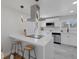 Modern kitchen with quartz countertops, sleek appliances, and stylish pendant lighting at 6641 Ash St, Commerce City, CO 80022
