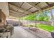 Spacious back patio with a picnic table, outdoor seating, and a well-maintained backyard at 13558 E Center Ave, Aurora, CO 80012