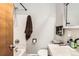 Bright bathroom featuring a shower and tub combo, vanity with sink, and a decorative mirror at 13558 E Center Ave, Aurora, CO 80012