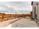 Lovely backyard featuring stone landscaping, a concrete patio, and a privacy fence creating an inviting outdoor area at 15920 Hayloft Ln, Parker, CO 80134