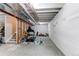 Unfinished basement with exposed beams, ready for customization, including a gym area and ample space at 15920 Hayloft Ln, Parker, CO 80134