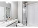 Clean bathroom with a glass-enclosed shower, and granite vanity at 15920 Hayloft Ln, Parker, CO 80134