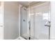 Bathroom showcasing glass shower with white subway tiles and modern fixtures at 15920 Hayloft Ln, Parker, CO 80134