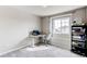 Bedroom featuring desk and shelving with natural light from a large window at 15920 Hayloft Ln, Parker, CO 80134