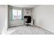 Bright bedroom with a desk and shelving with natural light from a large window at 15920 Hayloft Ln, Parker, CO 80134