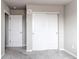 Neutral bedroom featuring plush carpet, closet and natural lighting at 15920 Hayloft Ln, Parker, CO 80134