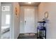 Inviting foyer with wood-look flooring, stylish decor, and an aquarium at 15920 Hayloft Ln, Parker, CO 80134