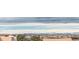 Panoramic skyline view showcases mountains and neighborhood, providing an appealing urban landscape at 15920 Hayloft Ln, Parker, CO 80134