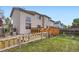 Beautiful backyard featuring a wooden deck, garden, and grass area at 401 W 114Th Pl, Northglenn, CO 80234