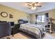 This bedroom features neutral walls, a ceiling fan, and comfortable carpet, perfect for relaxation at 401 W 114Th Pl, Northglenn, CO 80234