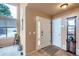 Welcoming entryway featuring tile flooring, a tall window, and neutral wall colors at 401 W 114Th Pl, Northglenn, CO 80234