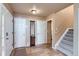 Warm entryway featuring tile flooring, a staircase, and neutral paint at 401 W 114Th Pl, Northglenn, CO 80234