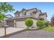 Charming home with a two-car garage, gray brick accents, and well-maintained landscaping at 401 W 114Th Pl, Northglenn, CO 80234
