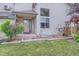 Inviting front porch with well-maintained lawn, tidy landscaping, and gray siding accents at 401 W 114Th Pl, Northglenn, CO 80234