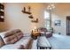 Inviting living room with high ceilings, large windows, neutral walls, and comfortable seating at 401 W 114Th Pl, Northglenn, CO 80234