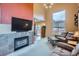 Cozy living room featuring a fireplace, large windows, and comfortable seating at 401 W 114Th Pl, Northglenn, CO 80234