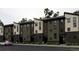 Modern townhome exterior with multi-tone facade and clean lines, set on a well-maintained street at 8410 W 52Nd Ave, Arvada, CO 80002