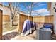 Enclosed backyard with brick patio, shrouded equipment, and privacy fencing at 1607 Cottonwood Dr # 14, Louisville, CO 80027