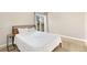 Cozy bedroom featuring neutral walls, a comfortable bed, and a sliding glass door to an outside balcony at 1607 Cottonwood Dr # 14, Louisville, CO 80027