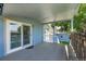 View of the covered deck with sliding glass doors, and shed at 8160 W 81St Pl, Arvada, CO 80005