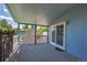 Covered deck with a sliding glass door to the home's interior at 8160 W 81St Pl, Arvada, CO 80005