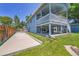 Exterior view of house with a covered deck, patio, and gated access at 8160 W 81St Pl, Arvada, CO 80005