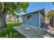 Side view of house featuring a covered deck and patio at 8160 W 81St Pl, Arvada, CO 80005