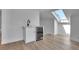 Contemporary bar area features a beverage refrigerator, a sink, and hardwood floors at 1343 Milwaukee St, Denver, CO 80206
