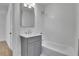 Classic bathroom features a vanity with storage and a shower-tub combo at 1343 Milwaukee St, Denver, CO 80206