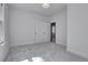 Carpeted bedroom featuring neutral paint, bright white trim, and a doorway leading into the hallway at 1343 Milwaukee St, Denver, CO 80206