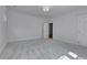 Carpeted bedroom with neutral paint, bright white trim, and a doorway leading into the hallway and a closet at 1343 Milwaukee St, Denver, CO 80206