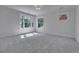 Bright, carpeted bedroom with ample natural light and neutral walls at 1343 Milwaukee St, Denver, CO 80206