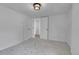 Neutral bedroom with carpet flooring and access to the hallway at 1343 Milwaukee St, Denver, CO 80206