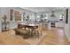 Bright dining area with modern lighting and seamless access to the kitchen at 1343 Milwaukee St, Denver, CO 80206